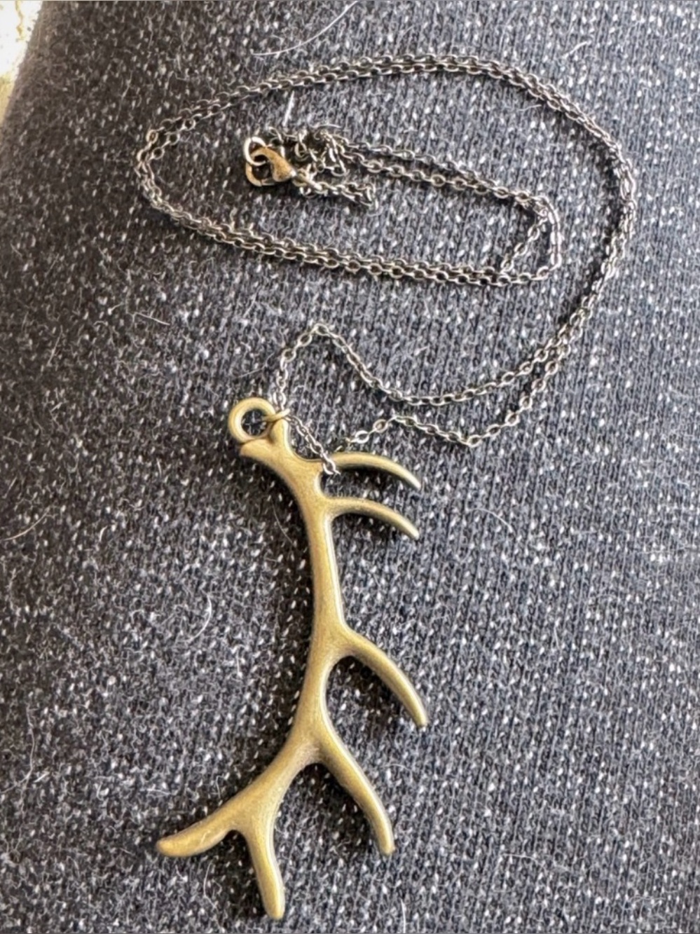 rustic antler pendant necklace with a bronze-toned finish